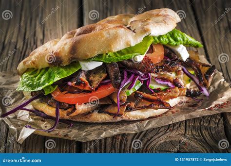 Close Up Of Kebab Sandwich On Wooden Background Stock Photo Image Of