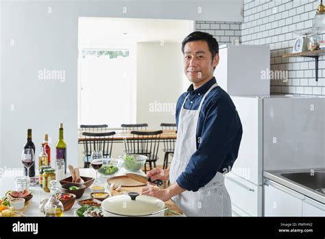 Japanese Mature Man In The Kitchen Stock Photo Alamy
