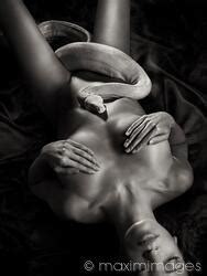 Photo Of Large White Boa Snake Coiling Up A Beautiful Nude Body Of A Woman With Skin Shining In