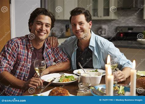 Male Gay Couple At Home For A Romantic Dinner Look To Camera Stock Photo Image Of Focus