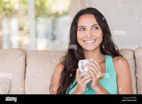 Pretty Brunette Holding Her Mug Stock Photo Alamy