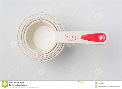 Set Of Measuring Cups Stacked On White Background Close Up Stock Photo