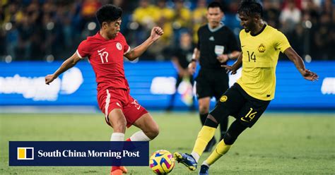 Football: Hong Kong beaten by Malaysia, lose a passport but may gain
