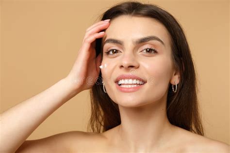 Close Up Half Naked Woman S With Perfect Skin Nude Make Up Applying Facial Cream Isolated On