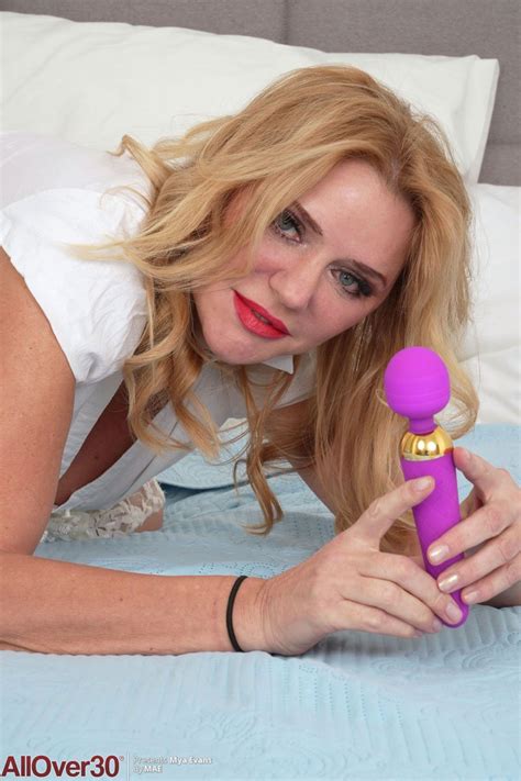 Mya Evans Takes Off Her White Dress And Introduces A Toy To Her Pussy Photos