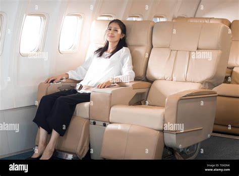 Elegant Mature Woman Relaxing On Airplane Stock Photo Alamy