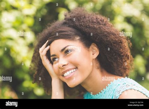 Gorgeous Smiling Brunette Posing For Camera Holding Her Head Stock Photo Alamy
