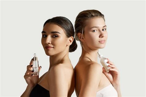 Premium Photo Beautiful Girls With Wellkept Skin And Nude Makeup Showing Face Beauty Products