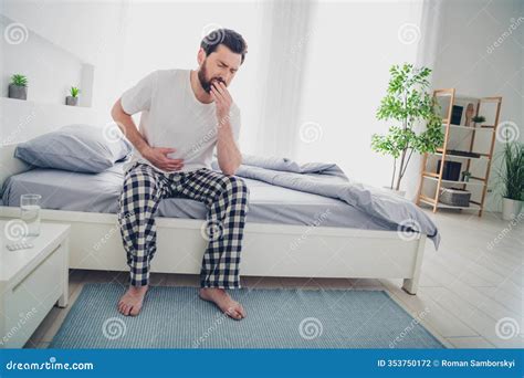 Photo Of Depressed Sad Mature Guy Dressed Sleepwear Sitting Bed Coughing Indoors Room Home House