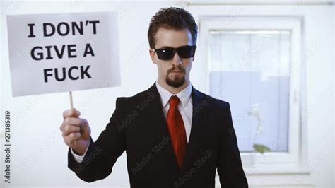 Vid O Stock Man In Business Suit Hold A Sign I Don T Give A Fuck K Medium Shot Of A Male