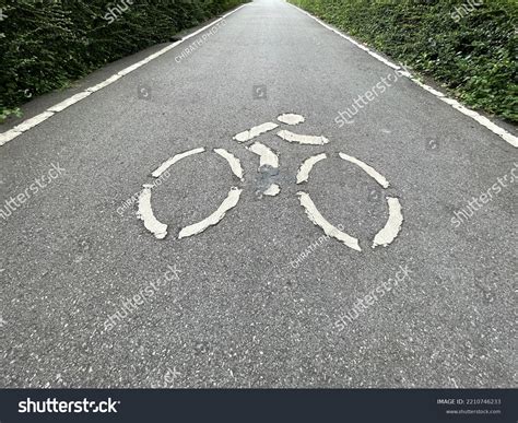 White Cyclist Symbol On Bicycle Lane Stock Photo 2210746233 Shutterstock