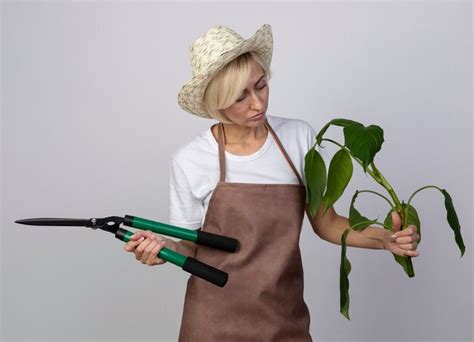 Free Photo Thoughtful Middle Aged Blonde Gardener Woman In Uniform