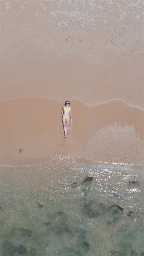 Caucasian Woman In A Bikini Lying On The Seashore On Vacation In Thailand Stock Video