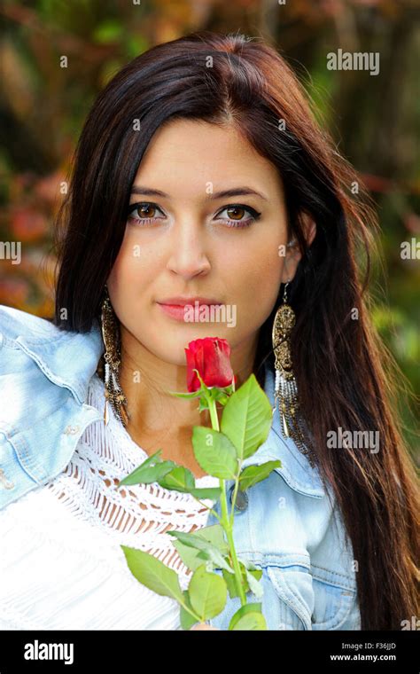 Beautiful Brunette With Red Rose Stock Photo Alamy