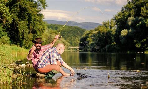 Fishing Activity Concept Retired Dad And Mature Bearded Son Big Game Fishing Happy Fishermen