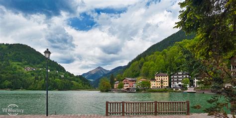 Lago Di Alleghe The Pretty Village Of Alleghe Sits On The Flickr