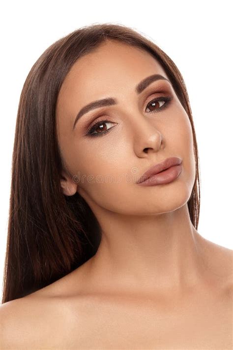 Close Up Portrait Of A Brunette Nude Model Girl With Professional Evening Make Up And Plump Lips