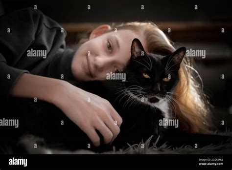 Cat Cuddling Hi Res Stock Photography And Images Alamy