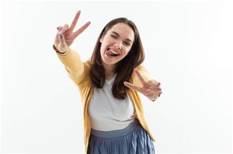 Premium Photo A Beautiful Brunette Makes A Face At The Camera Isolated