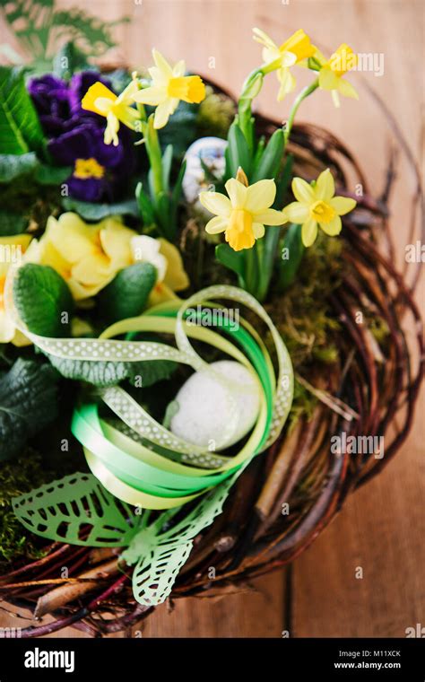 Easter Table Centerpiece Decoration With Daffodils And Easter Eggs