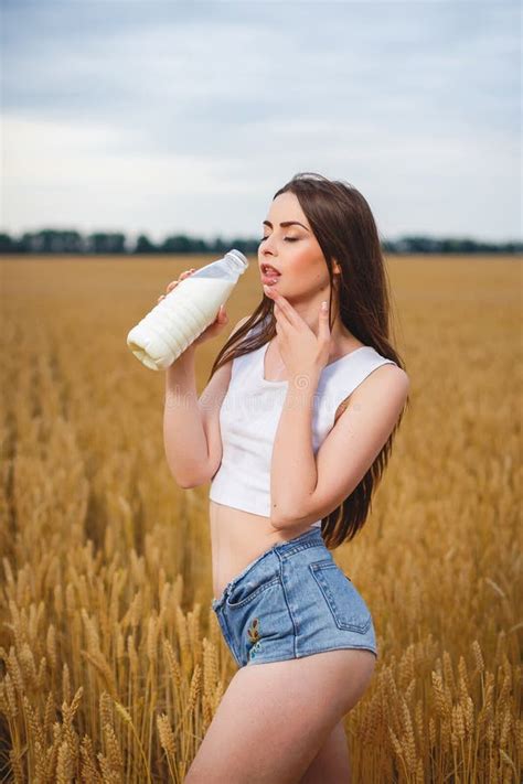 Beautiful Woman Is Drinking Milk In Countryside Stock Image Image Of Blonde Female