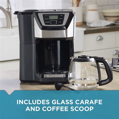 A Coffee Maker Sitting On Top Of A Kitchen Counter Next To A Glass Carafe