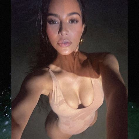 Kim Kardashian Shows Off Her Curves In A Nude SKIMS Swimsuit During Late Night Swim Before