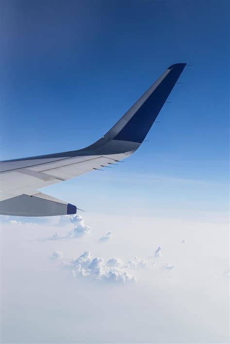 View of clouds from a airplane window 9587517 Stock Photo at Vecteezy