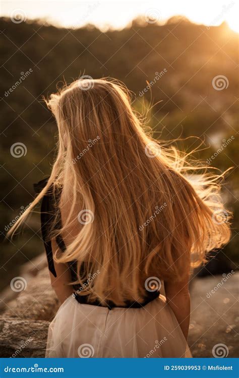 Blonde Long Hair Nature Summer Happy Adult Girl With Long Blond Hair Developing In The Wind In
