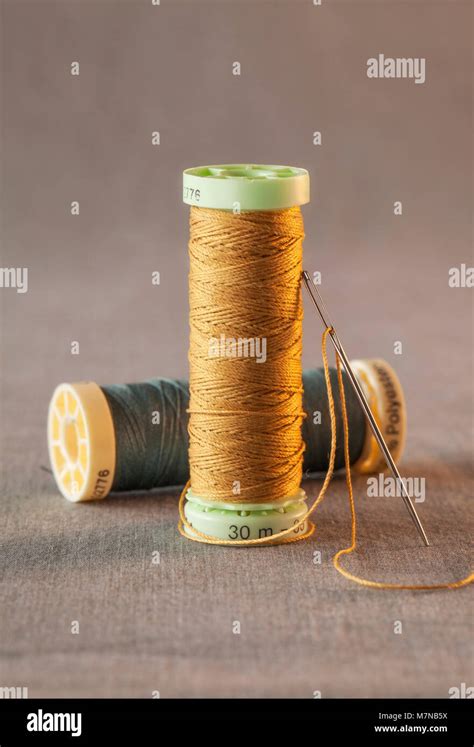 Colorful Threads With Sewing Needle Stock Photo Alamy