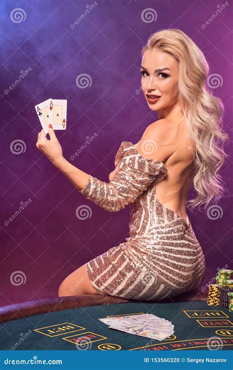 Blonde Woman With A Perfect Hairstyle And Bright Make Up Is Posing With Playing Cards In Her