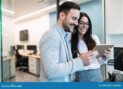 attractive business couple  tablet  modern office stock photo