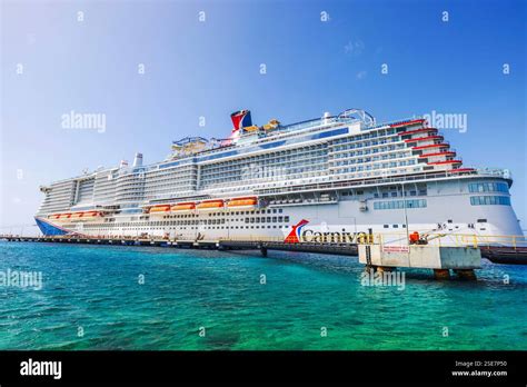 Carnival Cruise Ship Docked In Turquoise Water Caribbean Sea Under