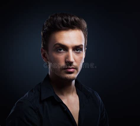 Young Man`s Portrait Close Up Face Against Gray Background Stock Photo