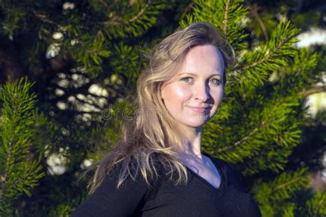 Blonde Woman Standing Near The Tree In The City Park In The Summer Portrait Stock Image