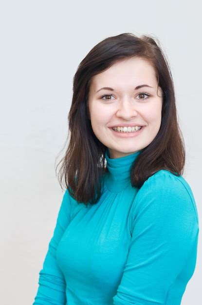 Premium Photo Beautiful Brunette Girl Smiling Cheerfully