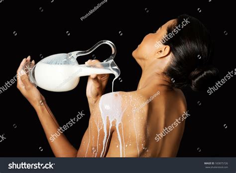 Beautiful Naked Woman Pouring Milk On Stock Photo 183875726 Shutterstock