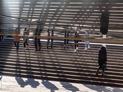 Pedestrians On The Stairs In The Underpass By Stocksy Contributor