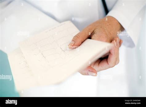 Doctor Holding Ecg Chart Stock Photo Alamy