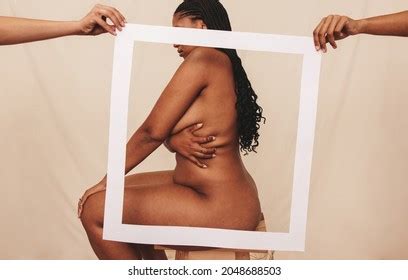 Naked Woman Sitting Sideways Behind Picture Stock Photo Shutterstock