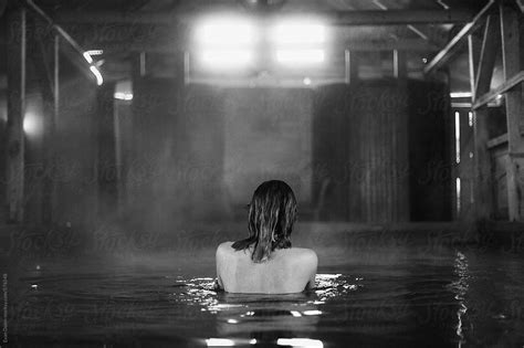 Woman Bathing In Hot Spring Pool By Stocksy Contributor Evan Dalen Stocksy