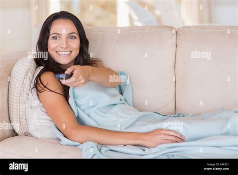 Pretty Brunette Relaxing On The Couch Stock Photo Alamy