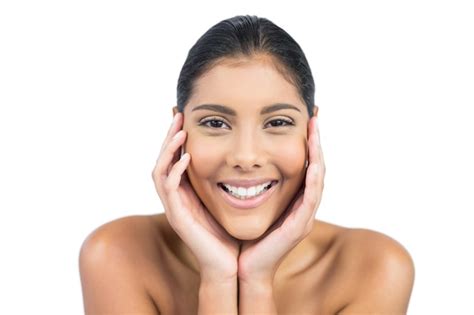 Premium Photo Cheerful Nude Brunette Touching Temples