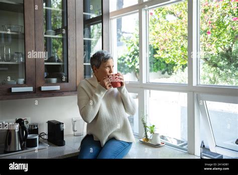 Mature Woman Alone At Home Stock Photo Alamy