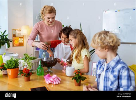 Plant Science Lesson Blonde Haired Teacher And Her Smart Pupils Having Amazing Plant Science