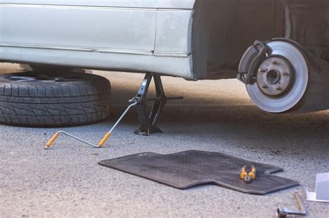Premium Photo Car Mechanic Fixing Car