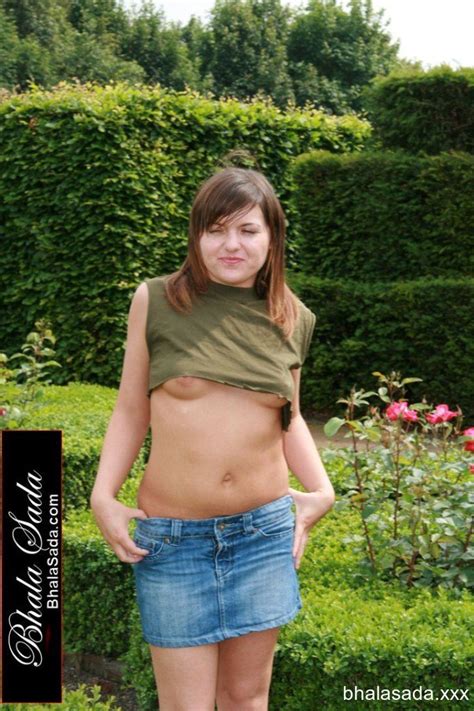 Hot Brunette Chick Loves Stripping While Posing With Guns Photos