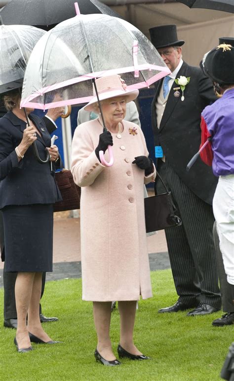 20 of Queen Elizabeth's Most Fashionable Umbrella Moments