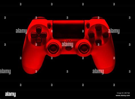 White Video Game Joystick Gamepad In Red Neon Lights Isolated On A