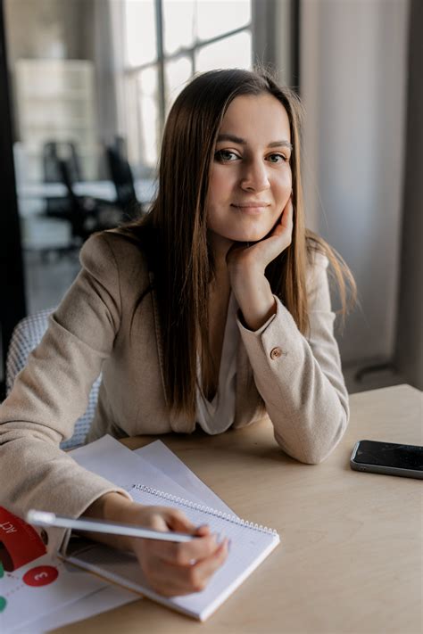 Person Writing Notes On White Ruled Paper · Free Stock Photo